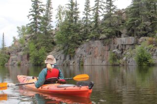 The Pinawa Dam Tour begins at ‘The Channel’ that once fed the Old Pinawa Dam downstream. We will paddle by granite bluffs and also encounter wetland surroundings as we meander our way down to the dam. Enjoy the 11 km paddle featuring diverse flora and fauna along the river including a wide variety of birds as well as painted and snapping turtles.
Previous paddling experience is required due to the tour length and the class two rapids along the way. This tour offers river and lake travel which leads us toward the old Pinawa Dam which we will explore after stopping for lunch. Paddling through intermittent rapids is a different challenge and this tour offers a good introduction to paddling in moving water. Instruction will be provided prior to the tour. Allow for 6 hours. Helmets provided.
This is a one way tour. Participants will be transported back to their vehicles after we’ve explored the dam.
See you on the water!