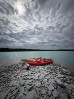 Little Limestone Lake is the largest marl lake in the world. Spending time in its clear turquoise waters is truly awe inspiring.
This trip is offered twice this year: July 17-19 and September 11-13.
This is a multi-day tour that includes three separate kayaking excursions (approximately 10 hours in total) to explore northern Manitoba on both Little Limestone and Footprint Lakes. Little Limestone Lake is known for its turquoise waters, smooth pebbled shores, and its ability to change colour at different periods of the day. This amazing lake, due to its distance from major centres, is a relatively untouched paradise. Participants of this tour will meet on the afternoon of the first day to embark on a Little Limestone Lake afternoon or evening paddle, retire to a nearby lodge for some nighttime relaxation, and then return the next morning to set out for a day tour to explore deeper into the lake. On the third day, participants will explore Cedar Lake or Footprint Lake, a beautiful water body nearby our accommodations north of Grand Rapids, MB. Times and exact locations for each excursion will be weather dependent. We will welcome what nature brings us.
Note: Little Limestone Lake is 5 hours north of Winnipeg, Manitoba. Lodging will be at Moak Lodge near Grand Rapids, MB, about 40 minutes way from Little Limestone Lake.
Accommodations will offer shared cabin spaces. Participants provide their own meals and can prepare them in the shared kitchen.
Previous lake kayaking experience is required. These are large lakes that can challenge even experienced paddlers when the weather turns. But it is so worth it!